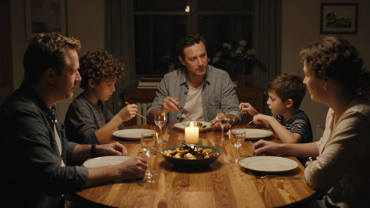 A family having an intimate, device-free dinner around a round wooden table by candlelight.